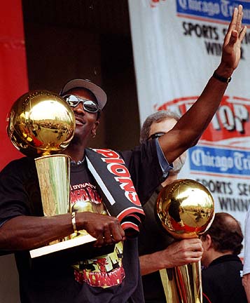 Jordan Holds One Of His 6 Championship Trophies