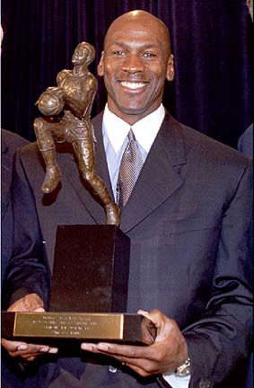 Jordan Holds The Most Valuable Player Trophy